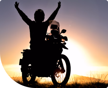 Motorcycle rider in the sun happy he choose calcas.