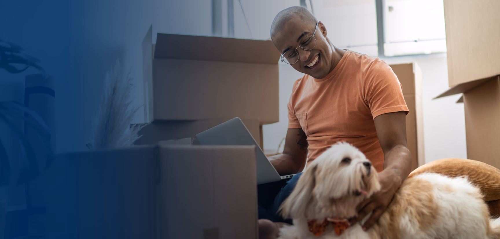 Man and his dog moving into a new apartment 