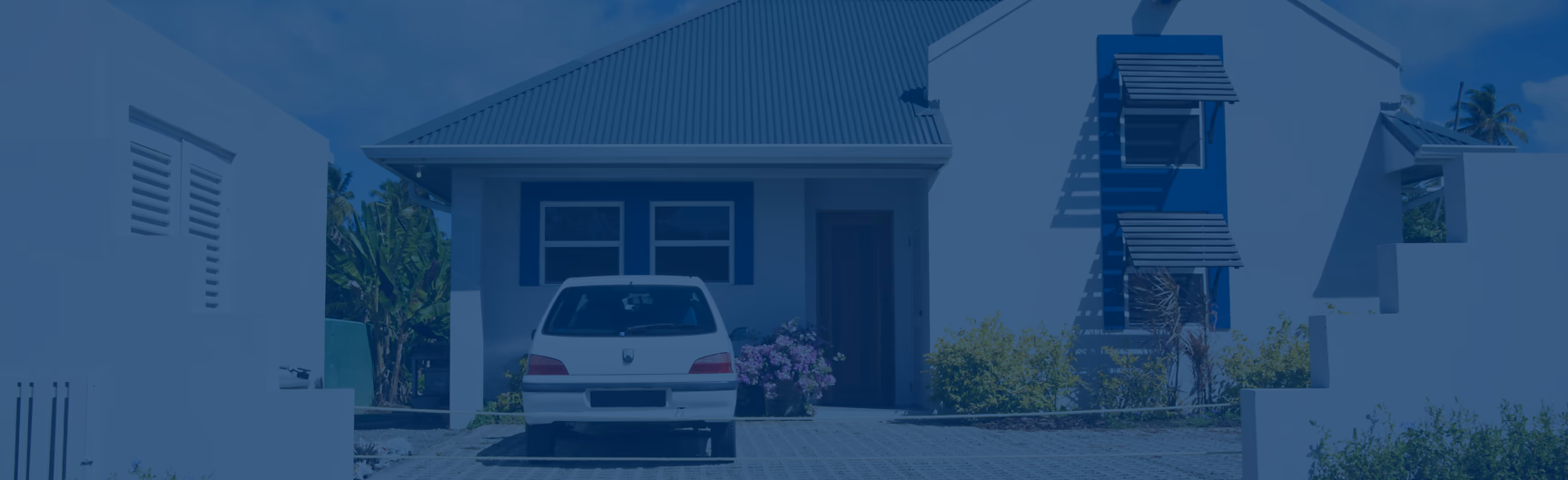 Exterior front of a home with a car parked in front