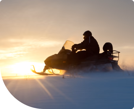 person riding snowmobile