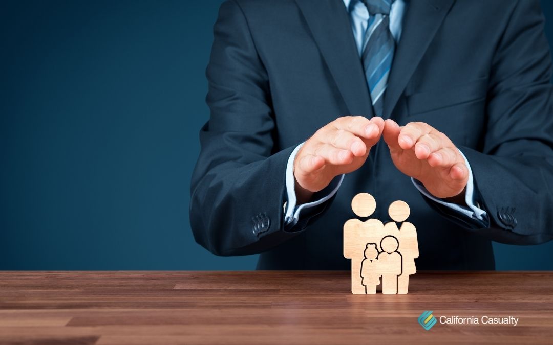 hands held in air over miniature of family