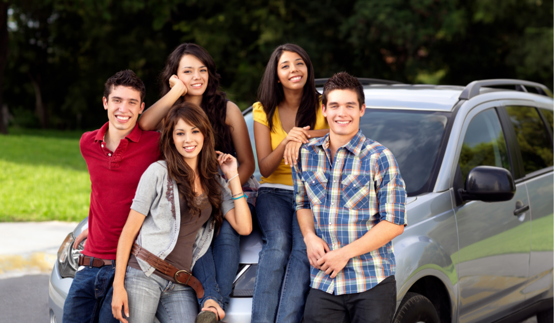 Group of High School Teens in front of car