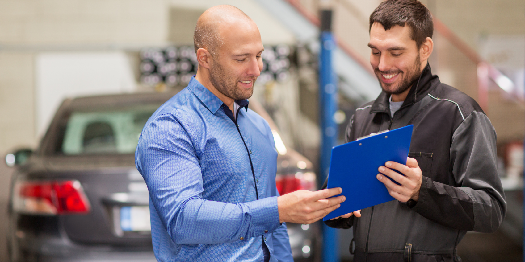 two men in repair shop