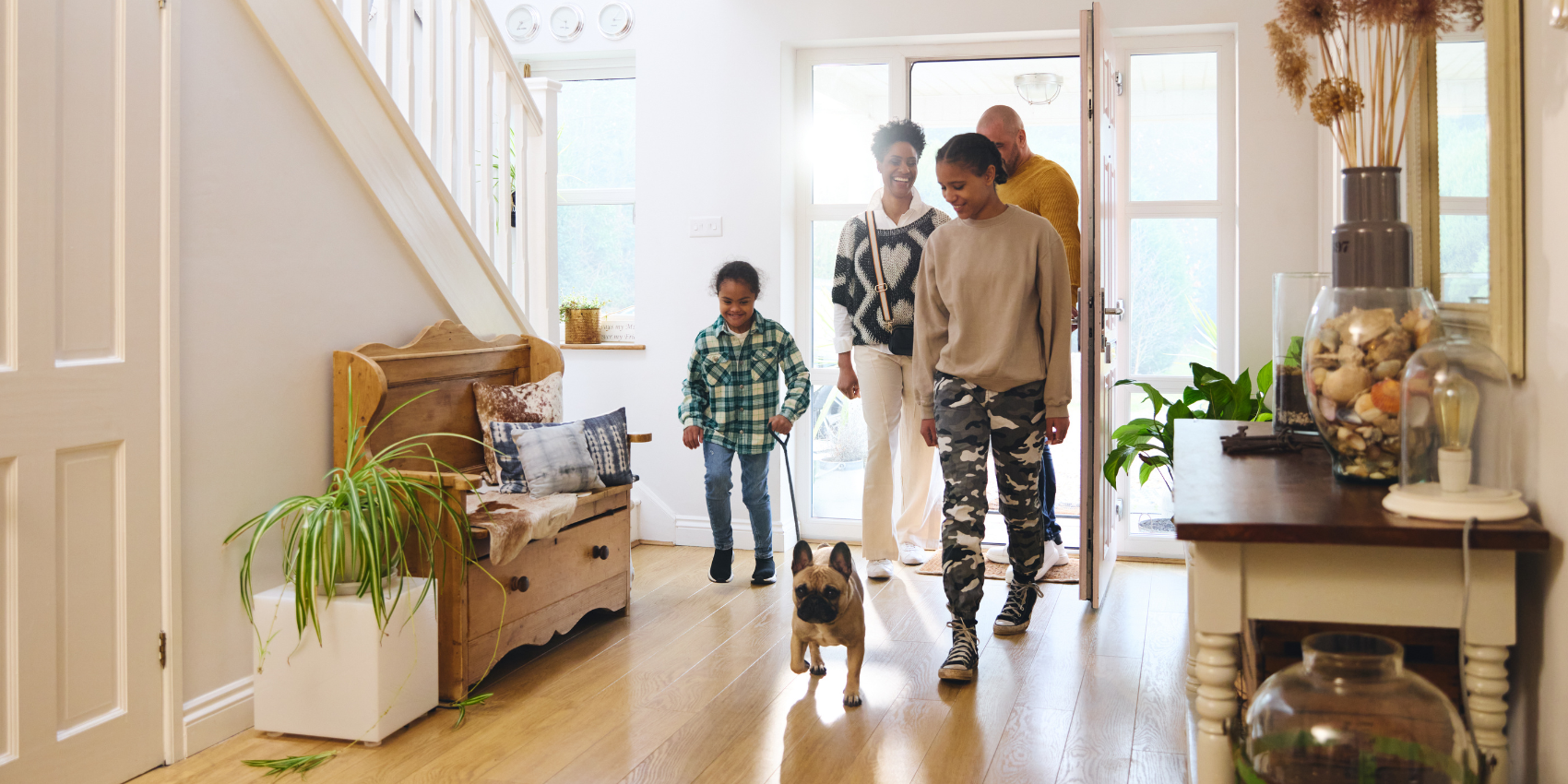 family coming through front door